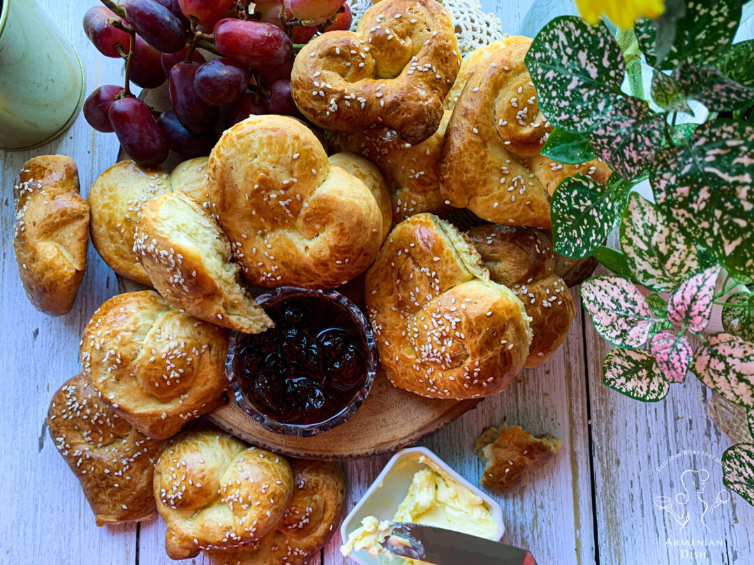 Heart-shaped Armenian Choreg Easter Bread on table with butter and jam