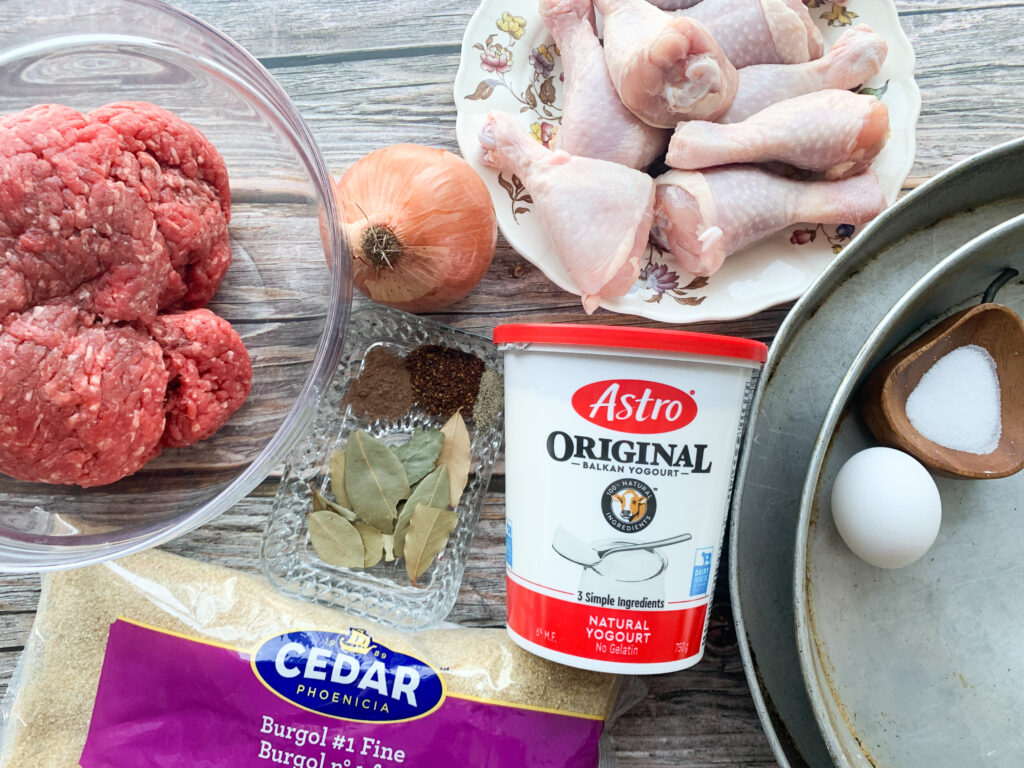 Ingredients for making madzoonov kufteh - meat, onion, chicken, salt, spices, yogurt, bulgur, egg
